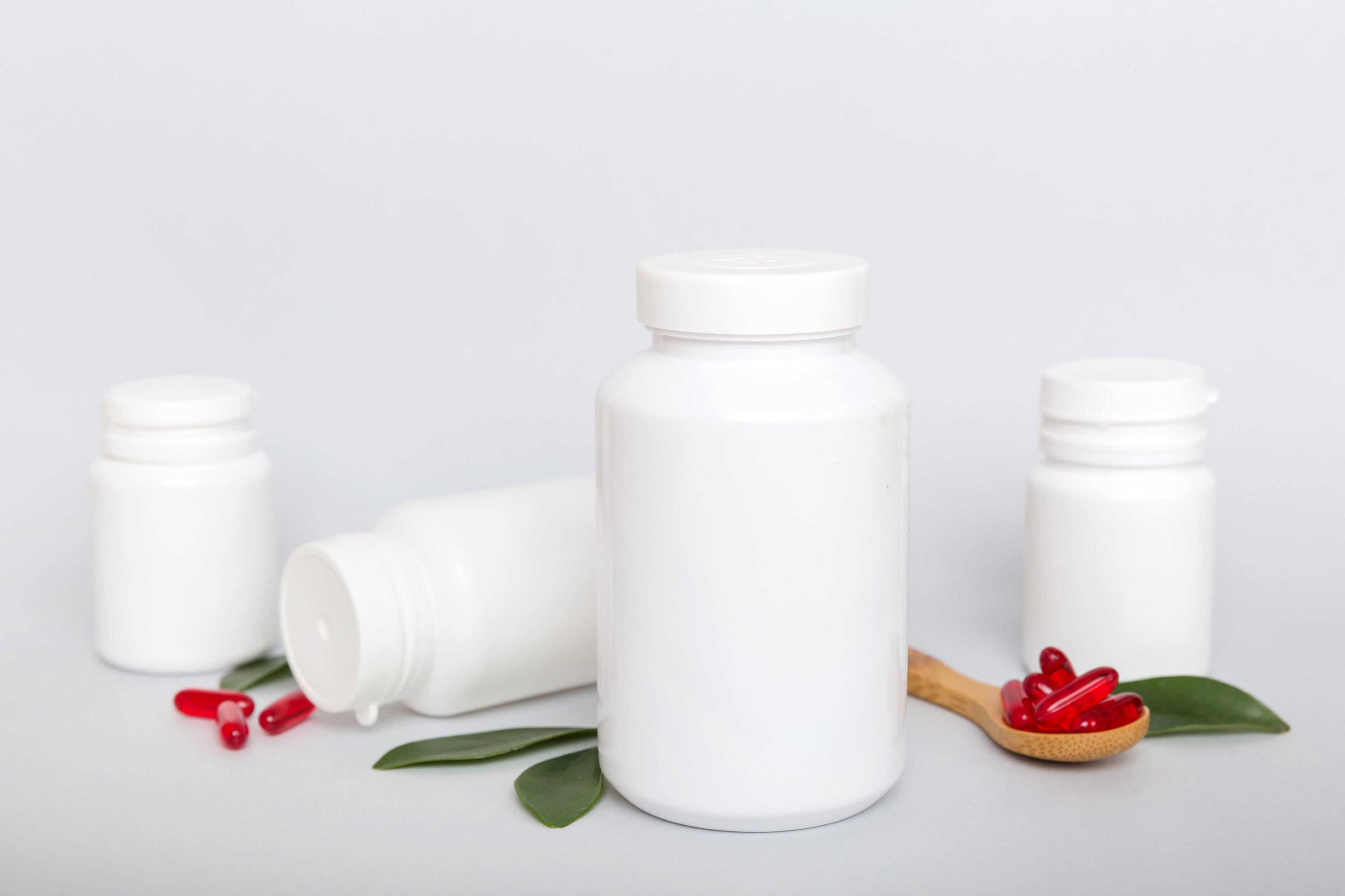 Assorted modern supplement formats like gummies, stick packs, and powders produced by European manufacturers specializing in trend-driven health products