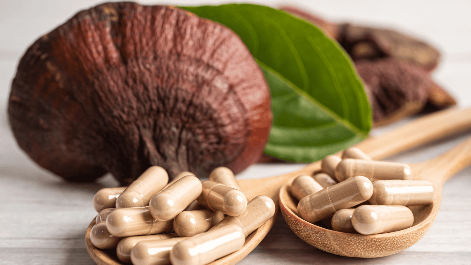 Assorted modern supplement products including mushroom powder jars, single-serve collagen gel packs, and sleep aid sachets on a neutral background